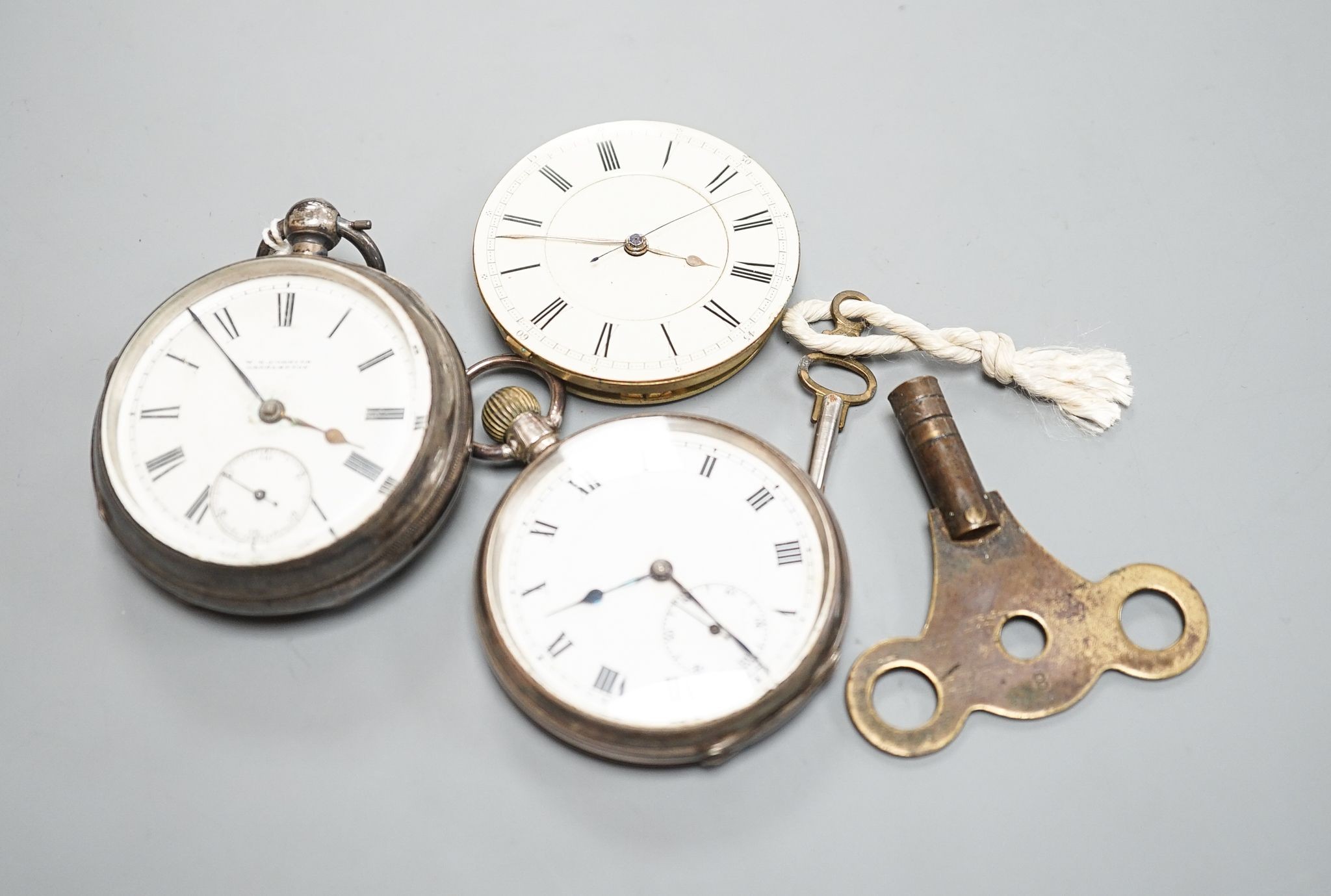 A late Victorian silver keywind open faced pocket watch, retailed by Cornish, Oakehampton, one other silver pocket watch and a pocket watch movement.